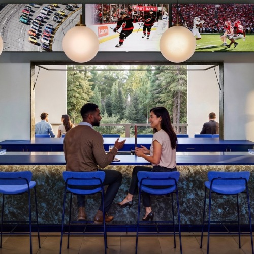 Clubhouse social lounge with bar seating at The Quincy in Charlotte, NC
