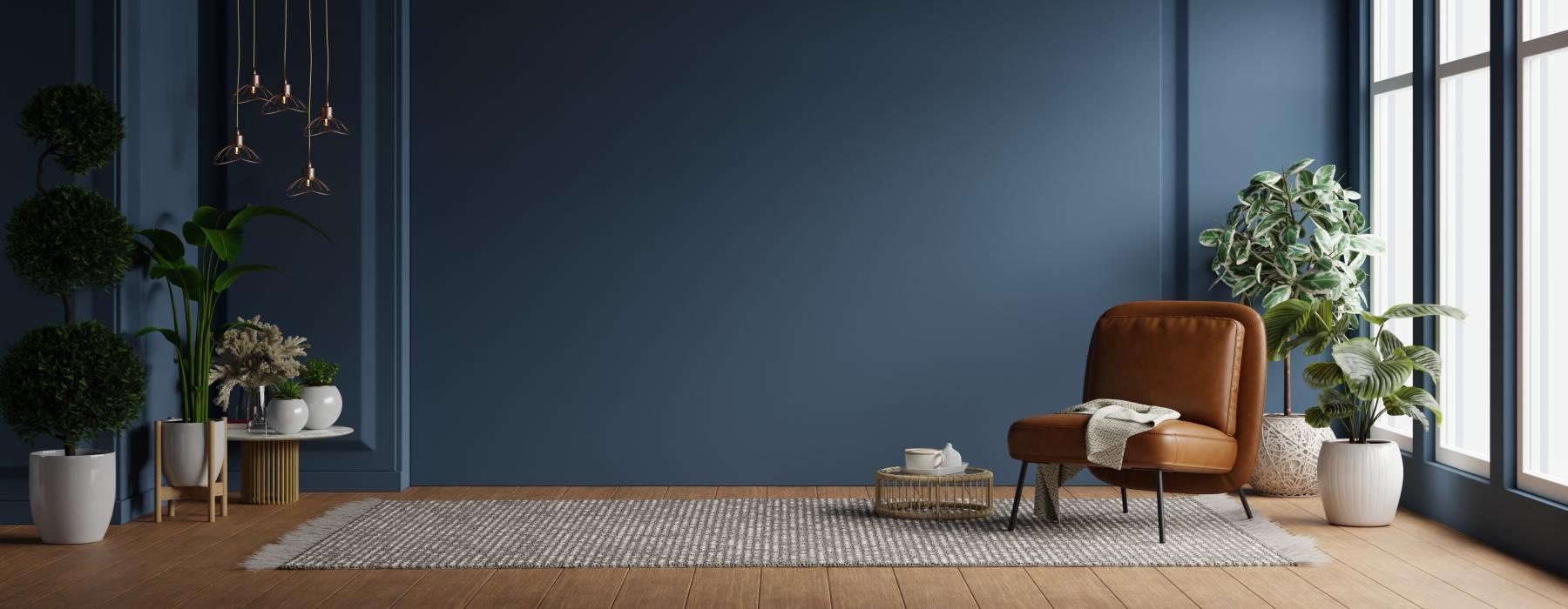 a room with a chair and plants